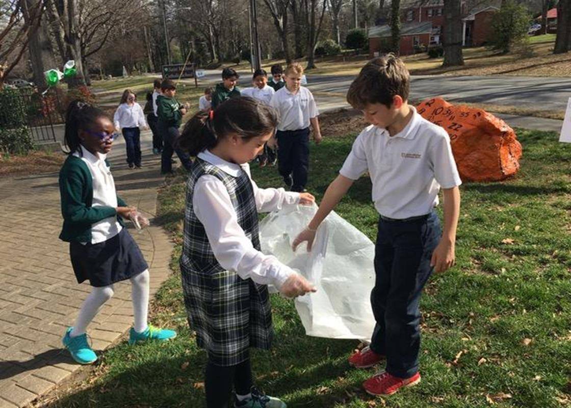 Students in Mrs. Boylan's fourth grade at St. Michael School were good citizens by cleaning up St. Michael’s playgrounds, yards, and gardens during Catholic School Week. (Photo via Facebook)