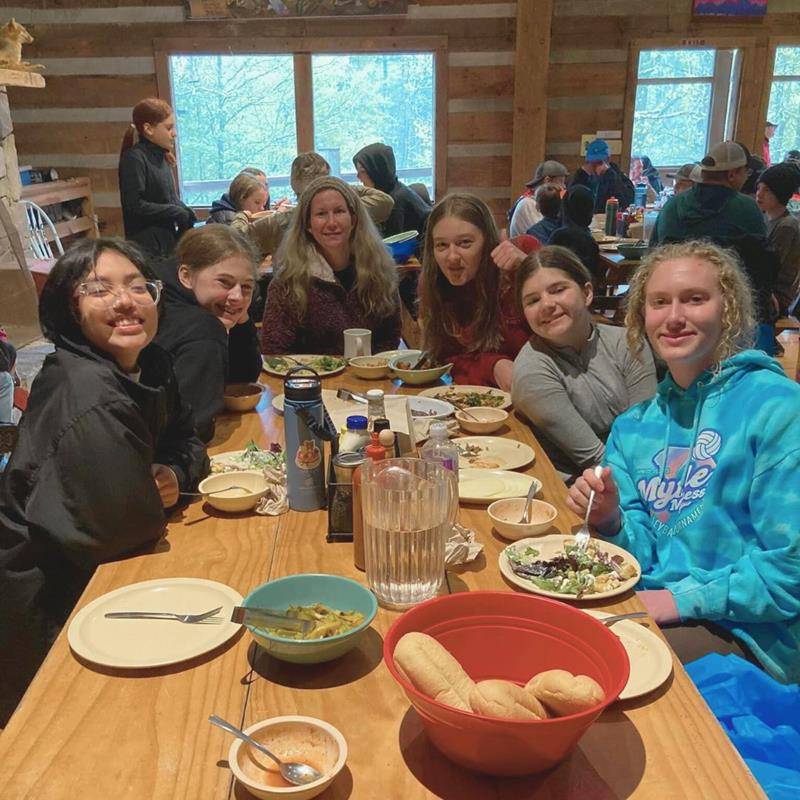 Seventh-grade girls nourished themselves in the cantine before the next activity.