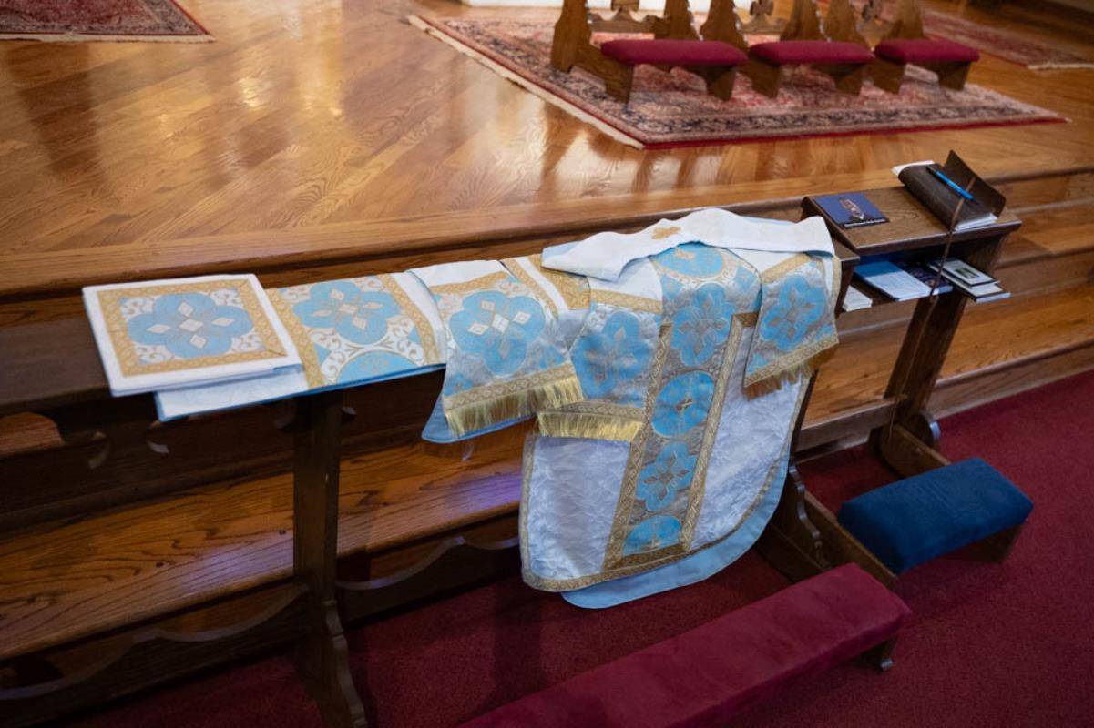 Chinonso Nnebe-Agumadu’s priestly vestments are Marian blue and ivory, featuring a crown motif that pays homage to Mary as Queen of Heaven and Earth, chosen to honor the Blessed Mother who played a “huge part” in his vocation.
