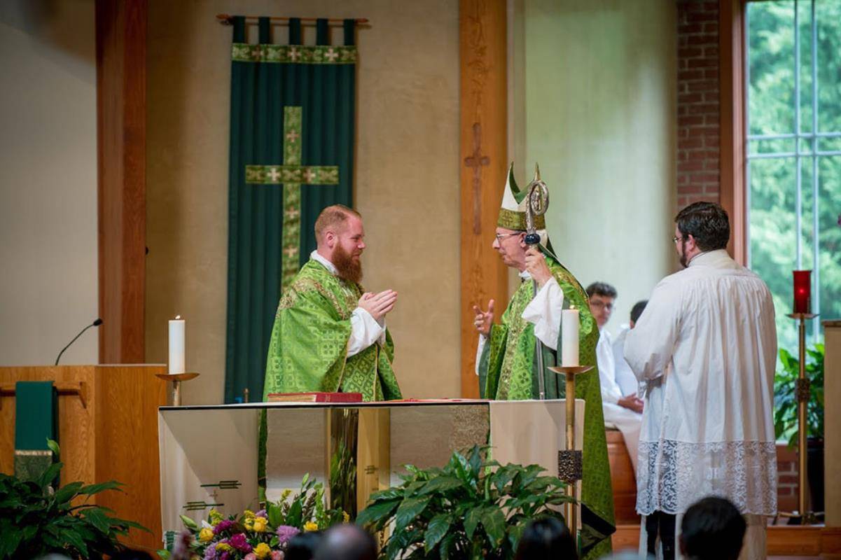Father Noah Carter is installed as pastor of Holy Cross Church in Kernersville