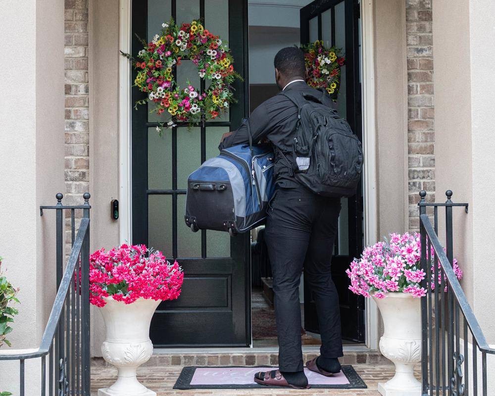 Nearly two dozen priests are settling into new parish assignments across the diocese, including newly ordained Father Chinonso Nnebe-Agumadu, pictured above, as he moves into the rectory at St. Mark Catholic Church in Huntersville. (Photos by Troy Hull)