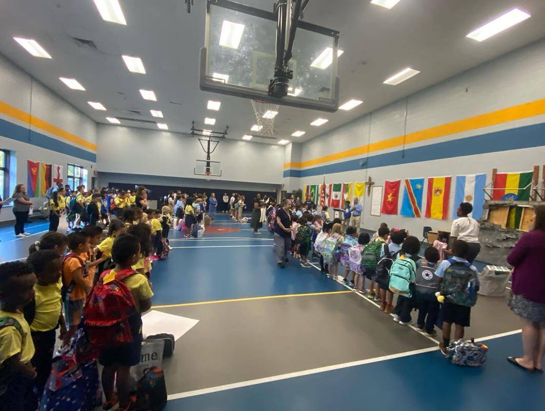 Principal Tyler Kulp welcomed new and returning students and staff at the morning assembly at Our Lady of the Assumption School.