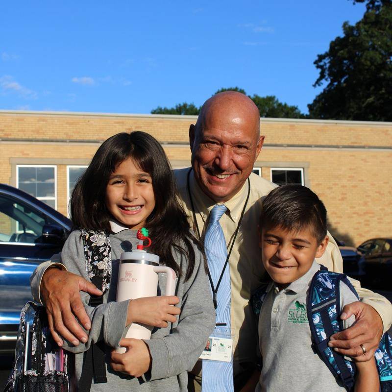 Students, faculty and parents smile for the first day of school at St. Leo School.