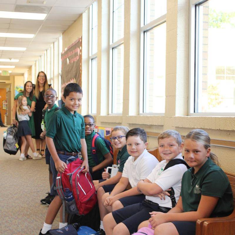 Students, faculty and parents smile for the first day of school at St. Leo School.