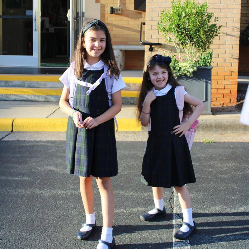 Students, faculty and parents smile for the first day of school at St. Leo School.