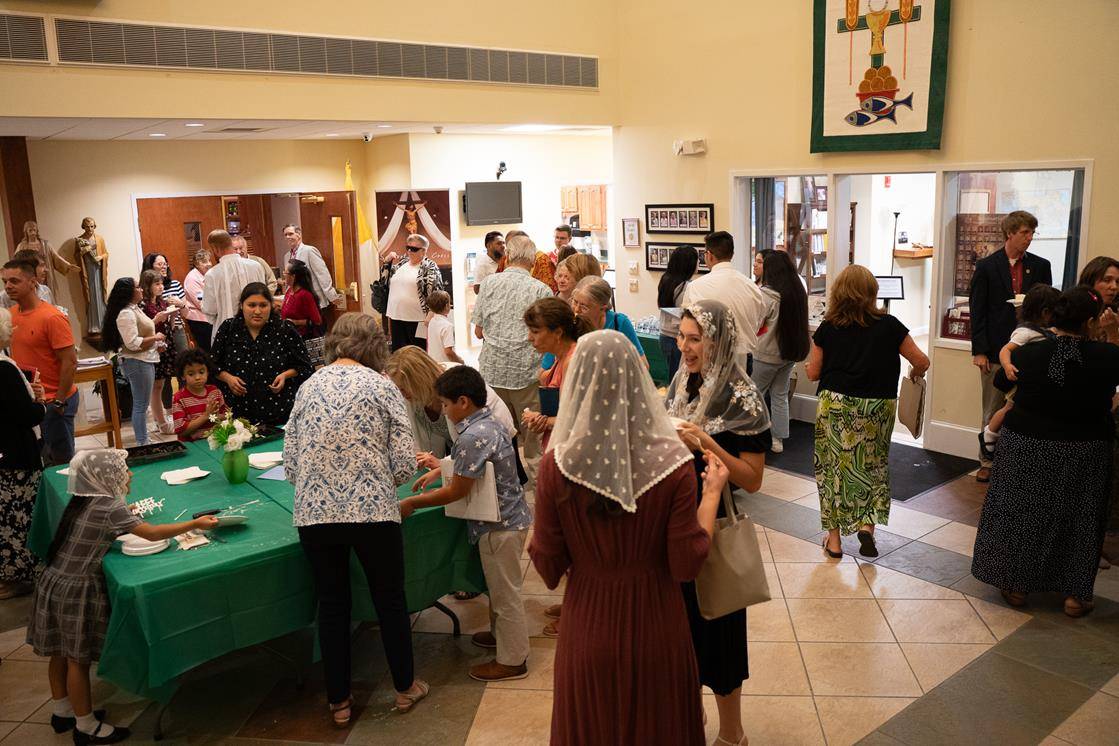 Parishioners enjoyed the reception after Mass.
