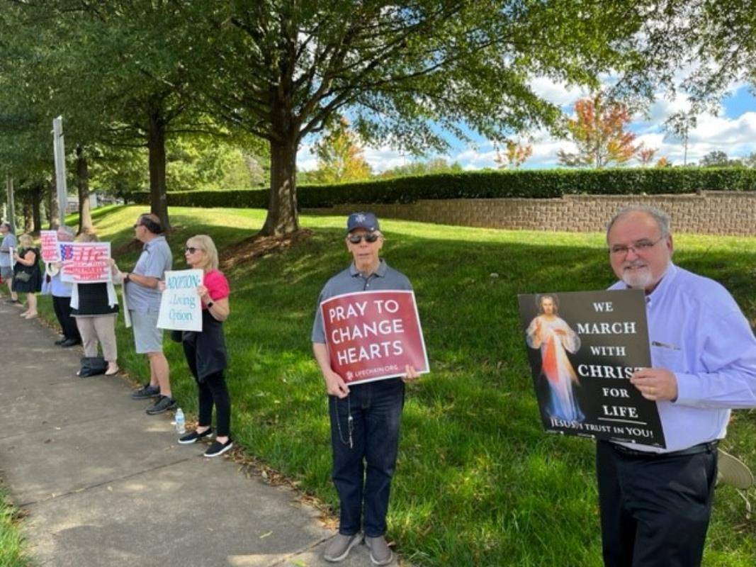 Father Darren Balkey, St. Matthew Respect Life Ministry Chaplain, lead parishioners in prayer before their Life Chain on Respect Life Sunday in Charlotte. 