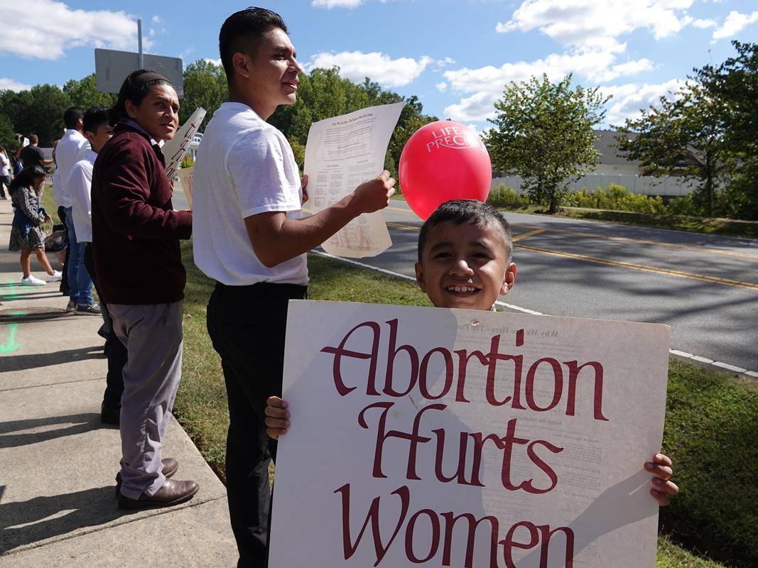 Around 175 people gathered outside St. Mark Church in Huntersville on Oct. 1, to join in the annual Life Chain. (Photos by Amy Burger)