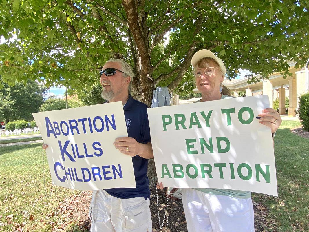 Around 175 people gathered outside St. Mark Church in Huntersville on Oct. 1, to join in the annual Life Chain. (Photos by Amy Burger)