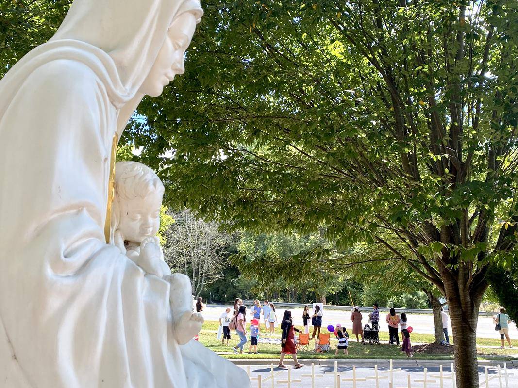 Around 175 people gathered outside St. Mark Church in Huntersville on Oct. 1, to join in the annual Life Chain. (Photos by Amy Burger)