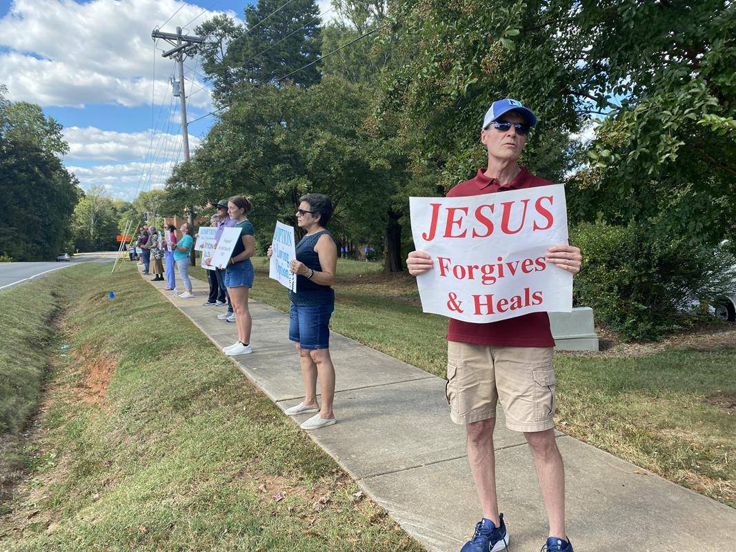 Around 175 people gathered outside St. Mark Church in Huntersville on Oct. 1, to join in the annual Life Chain. (Photos by Amy Burger)