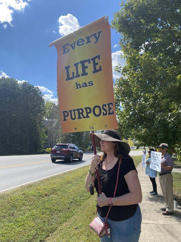 Around 175 people gathered outside St. Mark Church in Huntersville on Oct. 1, to join in the annual Life Chain. (Photos by Amy Burger)