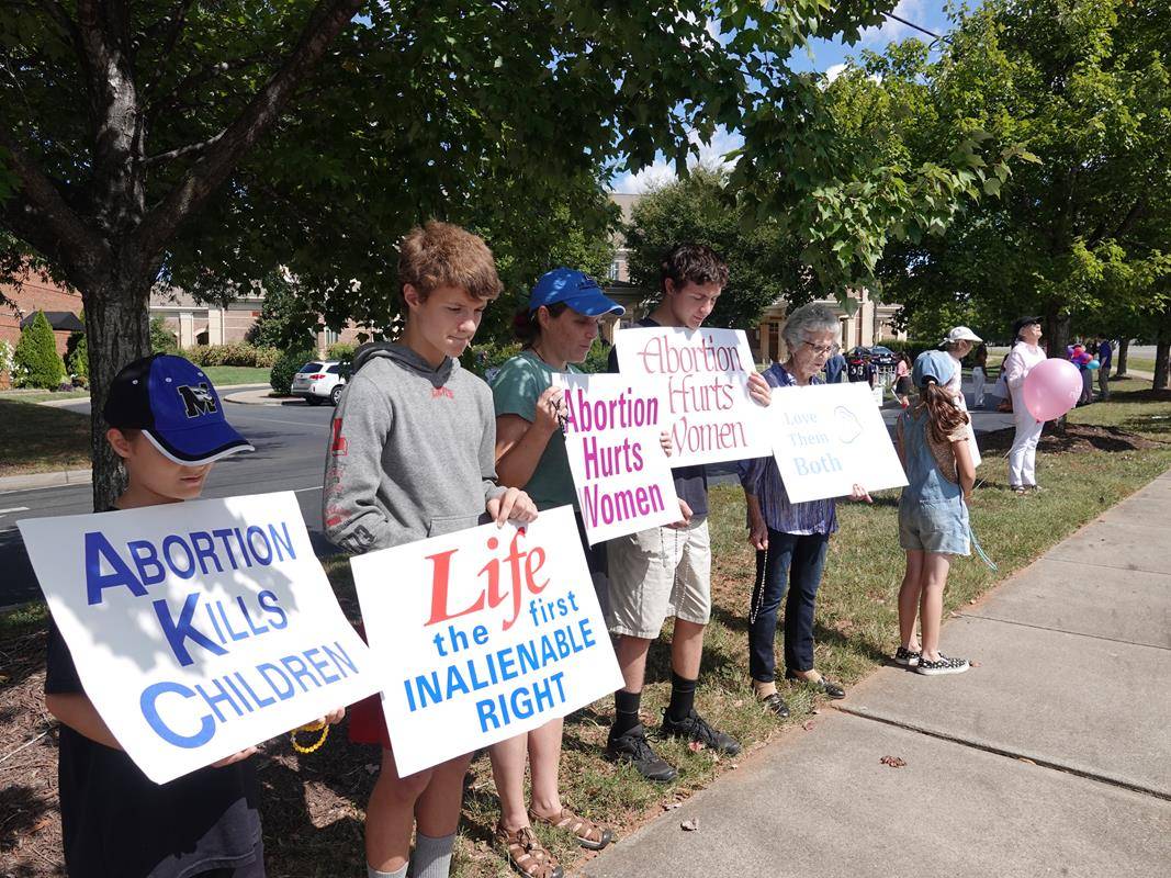 Around 175 people gathered outside St. Mark Church in Huntersville on Oct. 1, to join in the annual Life Chain. (Photos by Amy Burger)