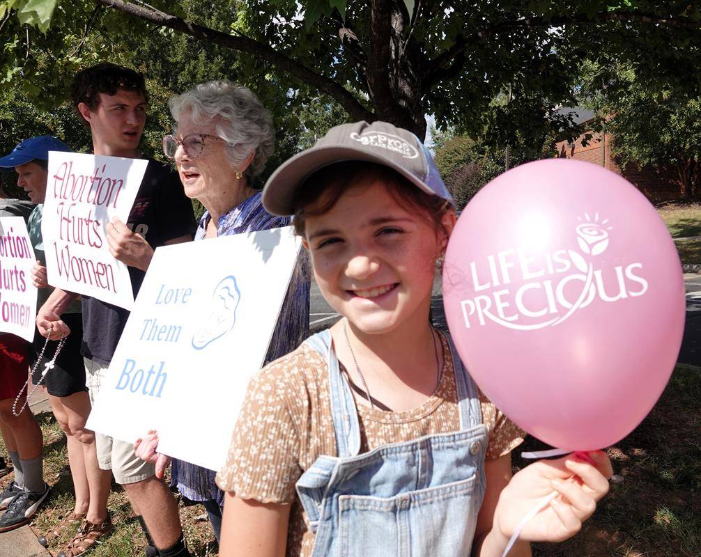 Around 175 people gathered outside St. Mark Church in Huntersville on Oct. 1, to join in the annual Life Chain. (Photos by Amy Burger)