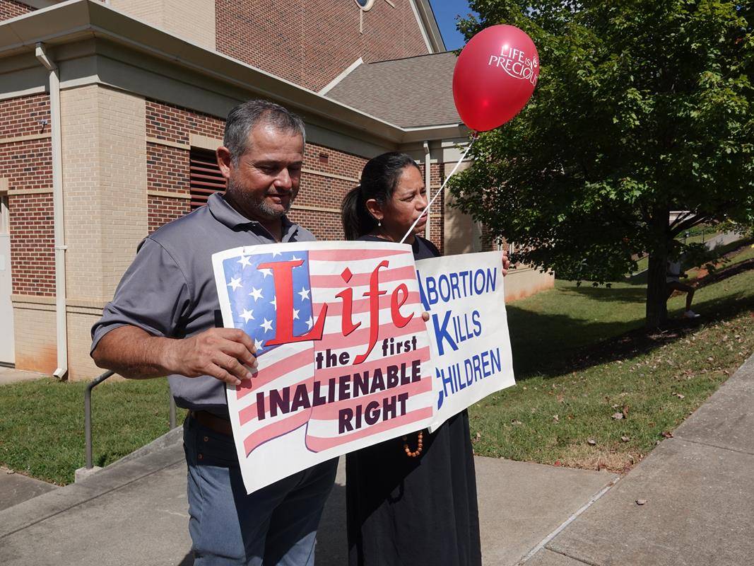 Around 175 people gathered outside St. Mark Church in Huntersville on Oct. 1, to join in the annual Life Chain. (Photos by Amy Burger)