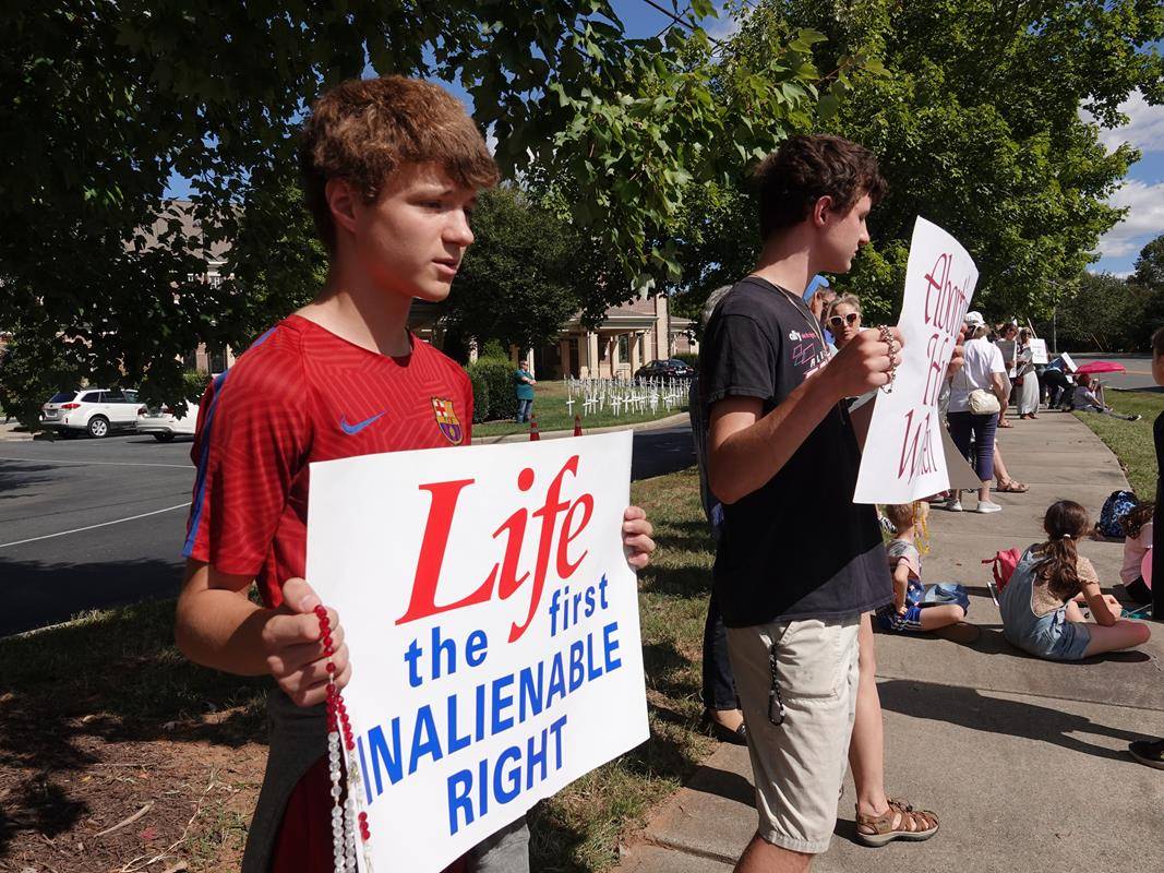 Around 175 people gathered outside St. Mark Church in Huntersville on Oct. 1, to join in the annual Life Chain. (Photos by Amy Burger)