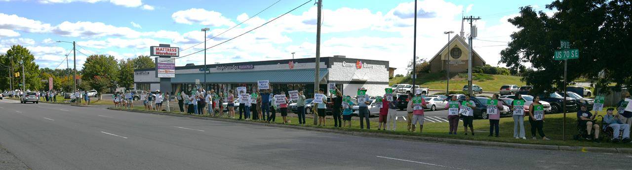 Particularly special were the grandmother who rolled down her car window and shouted, “Thank you, my grandson is adopted!”; as well as a young man who opened his car door to shout out that “I’m adopted!” with a big smile and fist shake.