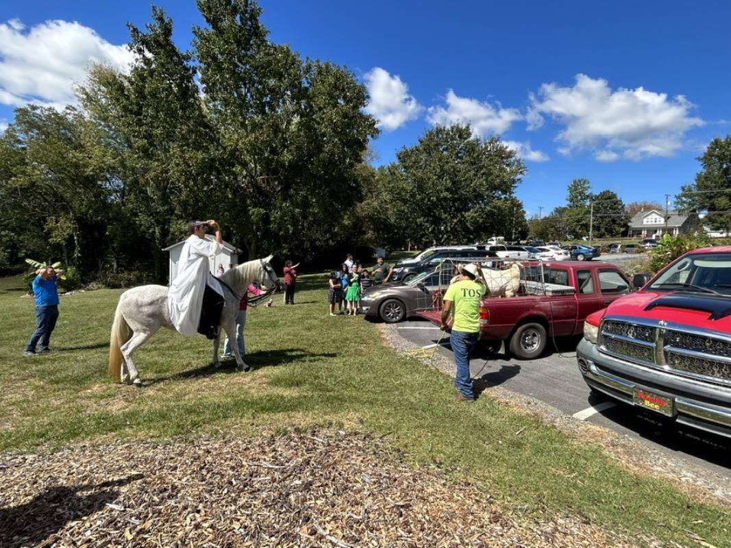 Father Jose Camilo blessing the animals at Holy Trinity Church in Taylorsville on horseback on Sunday, Oct. 1. (Provided photos)