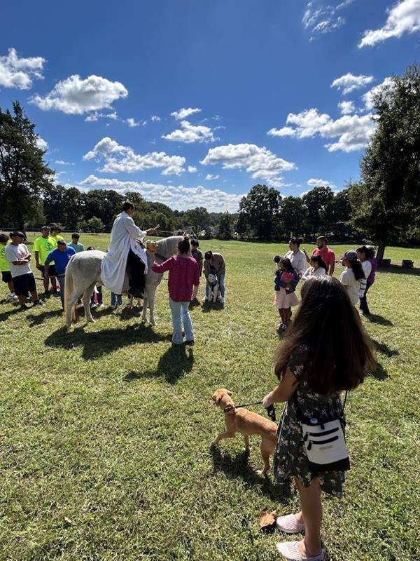 Father Jose Camilo blessing the animals at Holy Trinity Church in Taylorsville on horseback on Sunday, Oct. 1. (Provided photos)