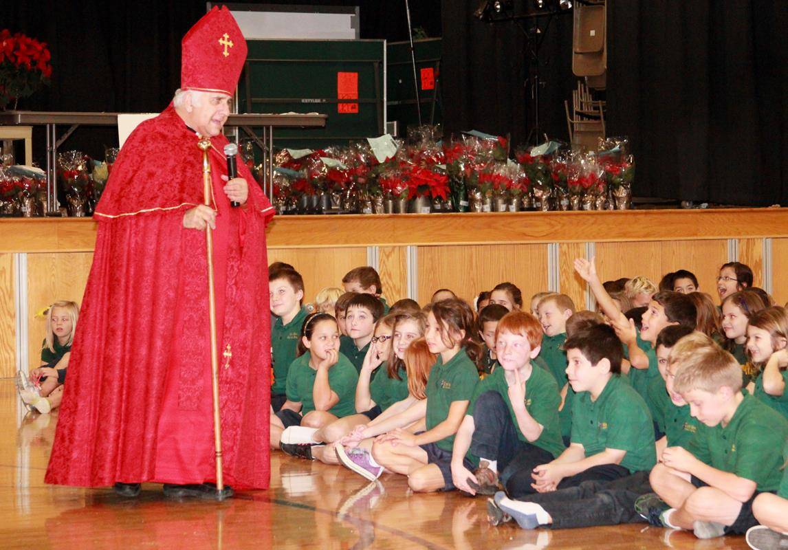 Msgr. Bellow dressed up as St. Nicholas each December to the delight of St. Mark students 