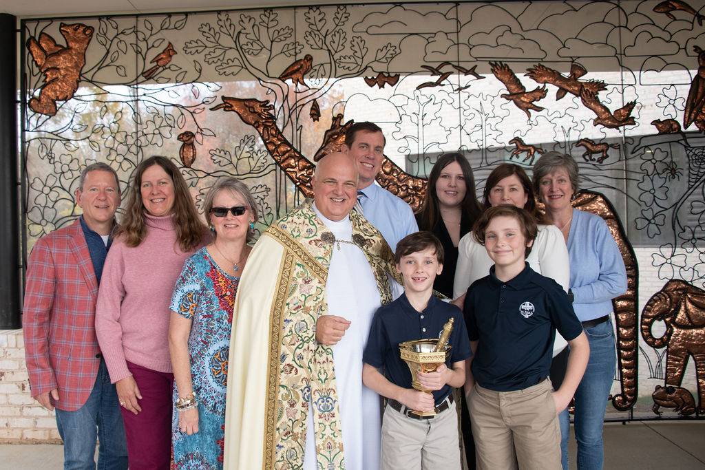 Monsignor Anthony Marcaccio with the Brady family at the dedication