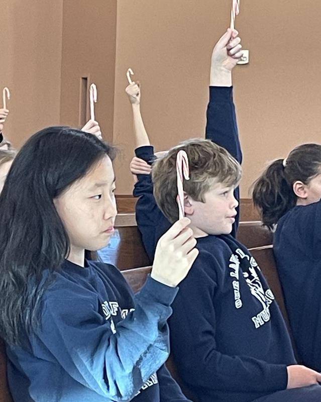 The candy canes blessed at Our Lady of Mercy represent St. Nicholas' bishop's crozier.