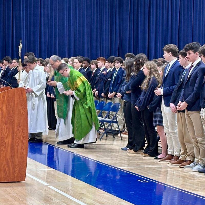 Father Christopher Brock celebrated an all-school Mass at Bishop McGuinness on Tuesday.
