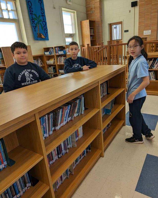 Our Lady of Mercy students also volunteered in the school library.
