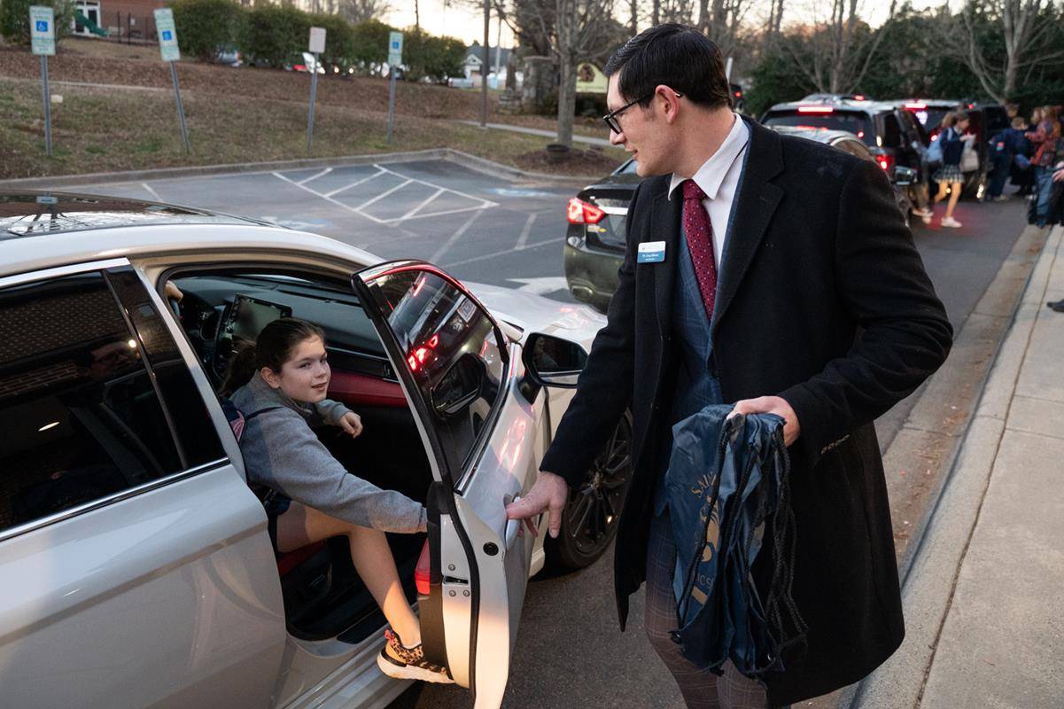 Dr. Gregory Monroe, Superintendent of Catholic Schools, greets students at St. Mark School in Huntersville for the start of Catholic Schools Week. 