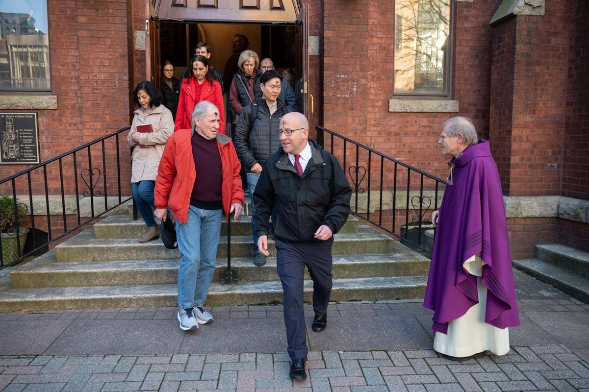 Faithful attend the 7:30 a.m. Ash Wednesday Mass at St. Peter Church in Charlotte. 