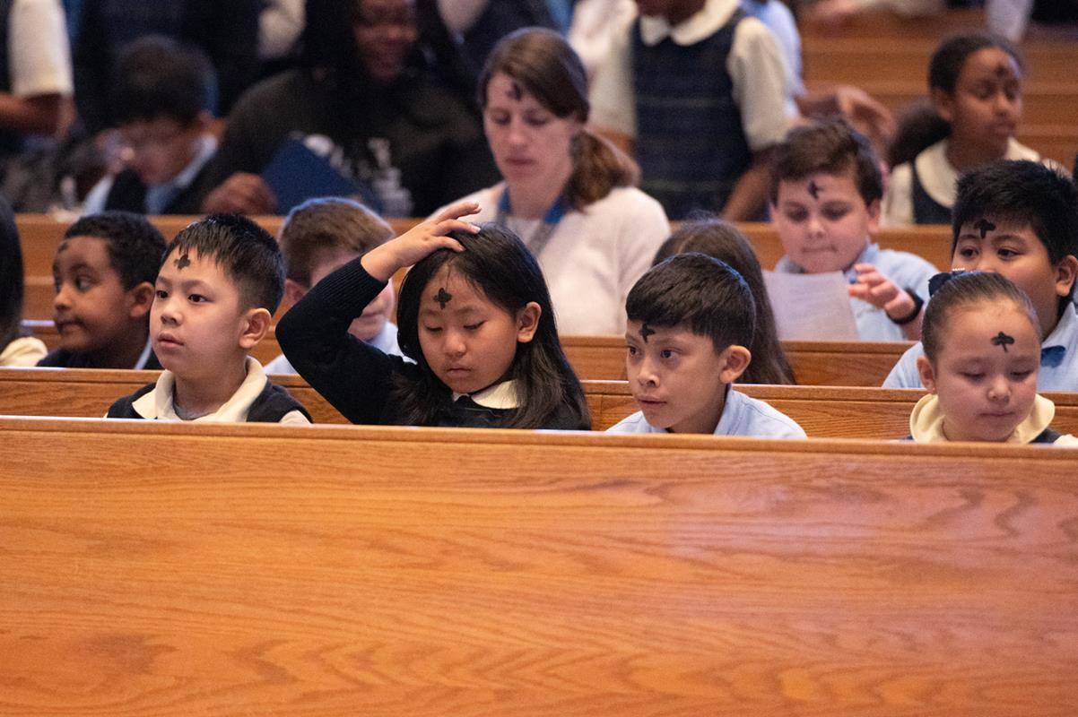 Father Victor Ameh, a priest of the Missionary Society of St. Paul of Nigeria, newly assigned to Our Lady of the Assumption in Charlotte celebrated Ash Wednesday Mass with students from Our Lady of the Assumption School. 