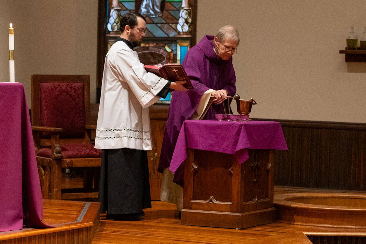 Faithful attend the 7:30 a.m. Ash Wednesday Mass at St. Peter Church in Charlotte. 