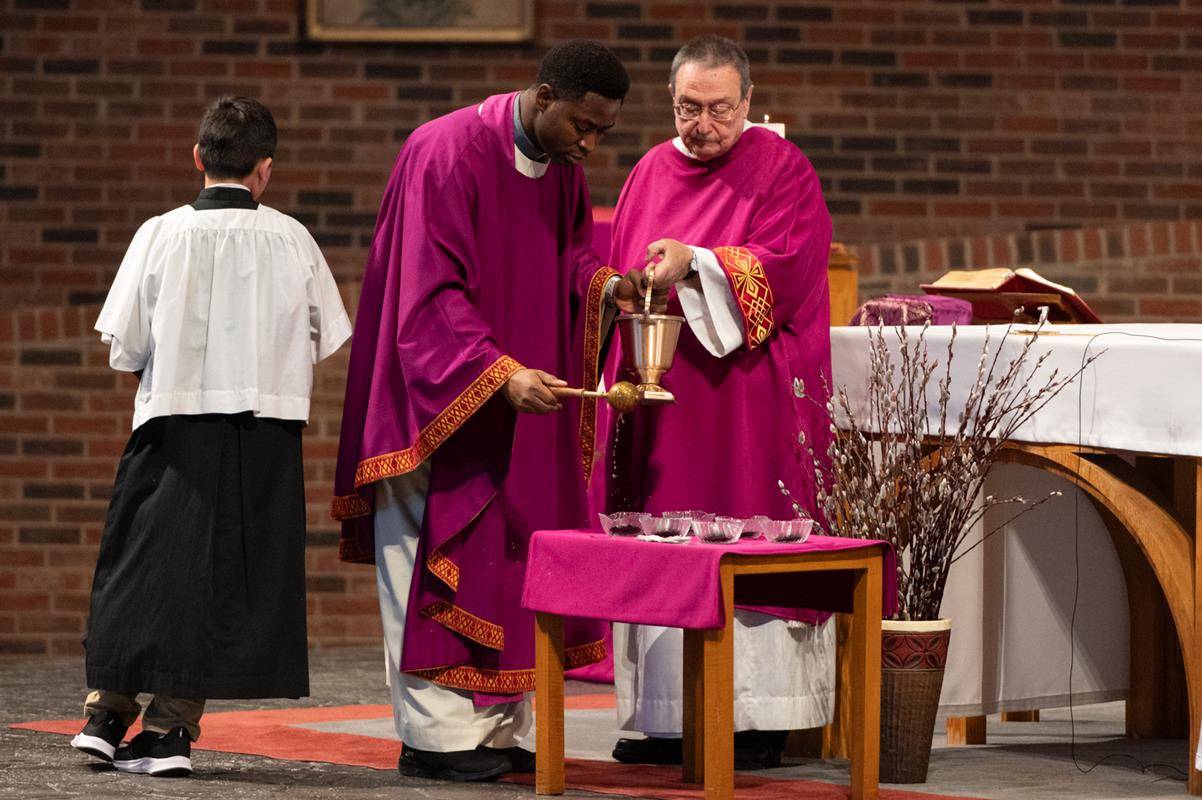 Father Victor Ameh, a priest of the Missionary Society of St. Paul of Nigeria, newly assigned to Our Lady of the Assumption in Charlotte celebrated Ash Wednesday Mass with students from Our Lady of the Assumption School. 