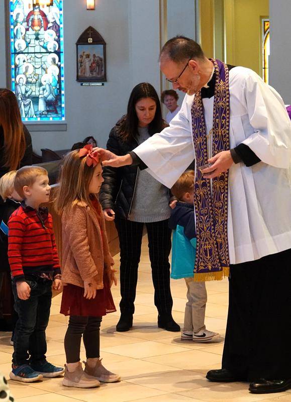 Father John Putnam and Deacon Tom McGahey held a special Liturgy of the Word and Ashes service for St. Mark School’s preschool students. 