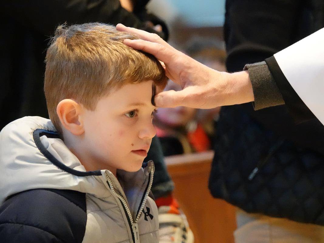 Father John Putnam and Deacon Tom McGahey held a special Liturgy of the Word and Ashes service for St. Mark School’s preschool students. 