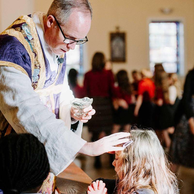 Father Timothy Reid celebrated Ash Wednesday Mass for St. Ann School students at St. Ann Church in Charlotte.