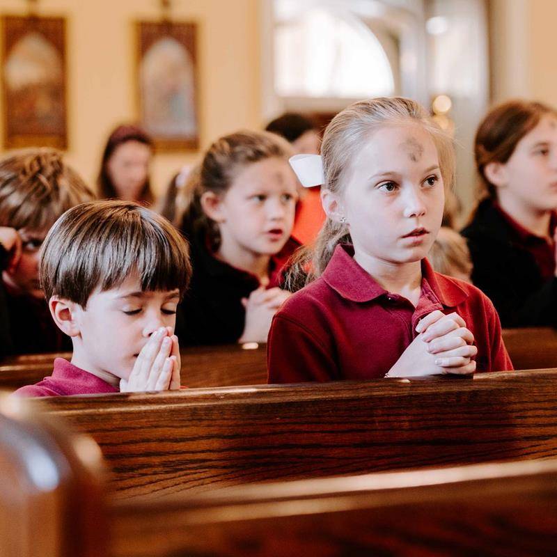 Father Timothy Reid celebrated Ash Wednesday Mass for St. Ann School students at St. Ann Church in Charlotte.