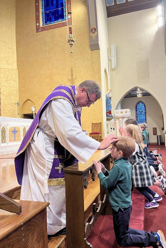 Students attend Mass on Ash Wednesday at St. Patrick Cathedral in Charlotte. 