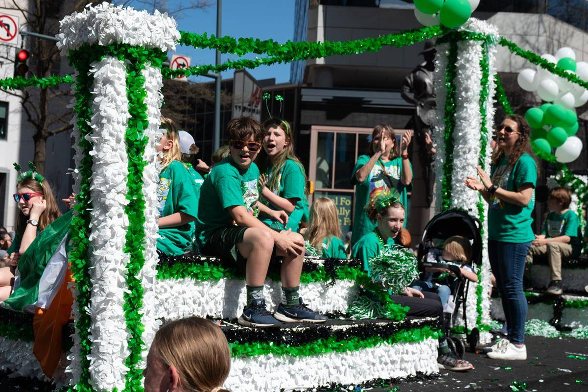Students, staff and family of St. Patrick school march in the parade.
