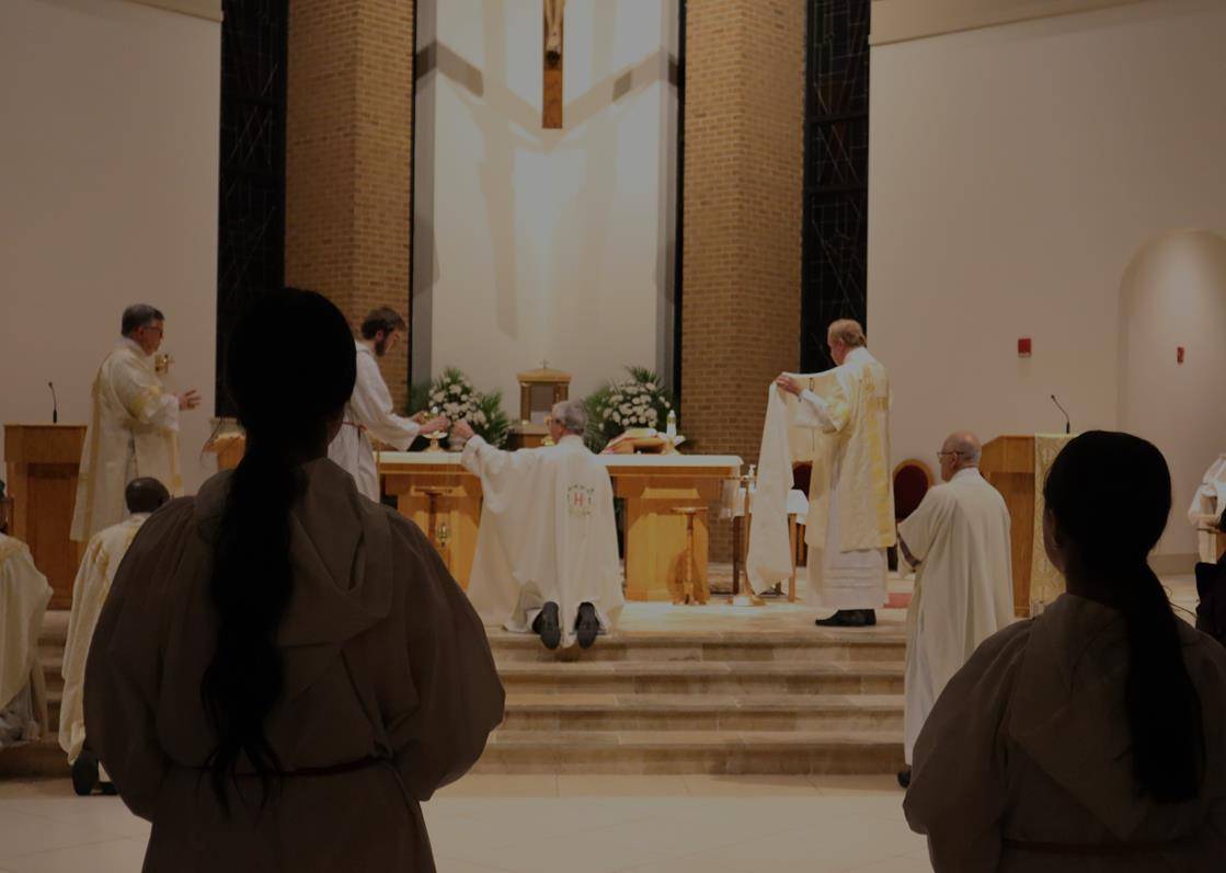Father Mark Lawlor celebrates Holy Thursday Mass at St. Therese Church in Mooresville.