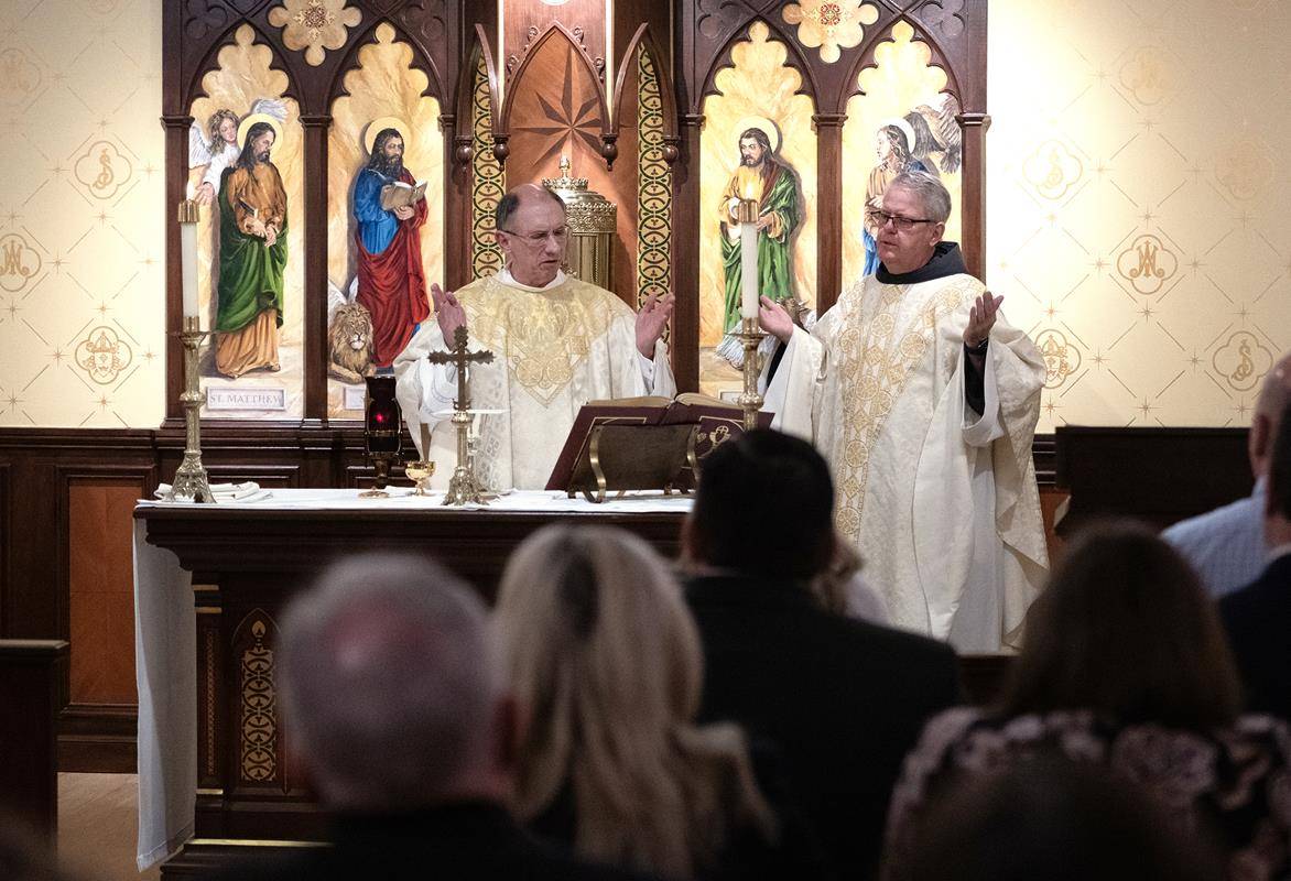 Charlotte Bishop-Elect Michael Martin, OFM Conv., and retiring Bishop Peter Jugis offer Mass in the Diocese of Charlotte Pastoral Center chapel April 9.