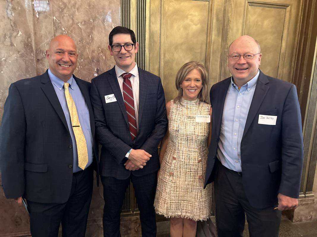 Gary Callus, principal of St. Leo Catholic School in Winston-Salem, Dr. Greg Monroe, superintendent of Catholic schools, Camile Denhard, director of leadership gifts for Catholic schools, and Jim Kelley, director of development for the diocese