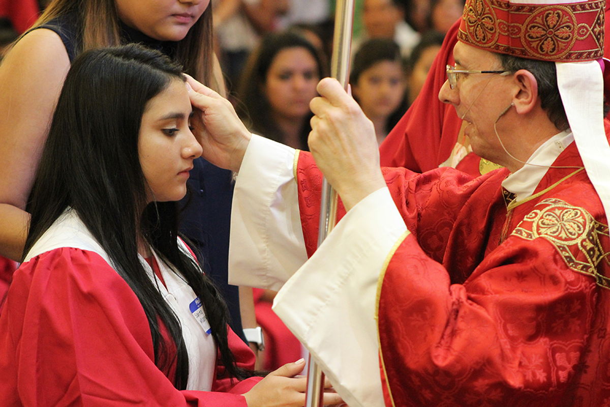 Young people at Our Lady of the Americas Church received the sacrament of confirmation from Bishop Peter Jugis during Mass celebrated in 2018 