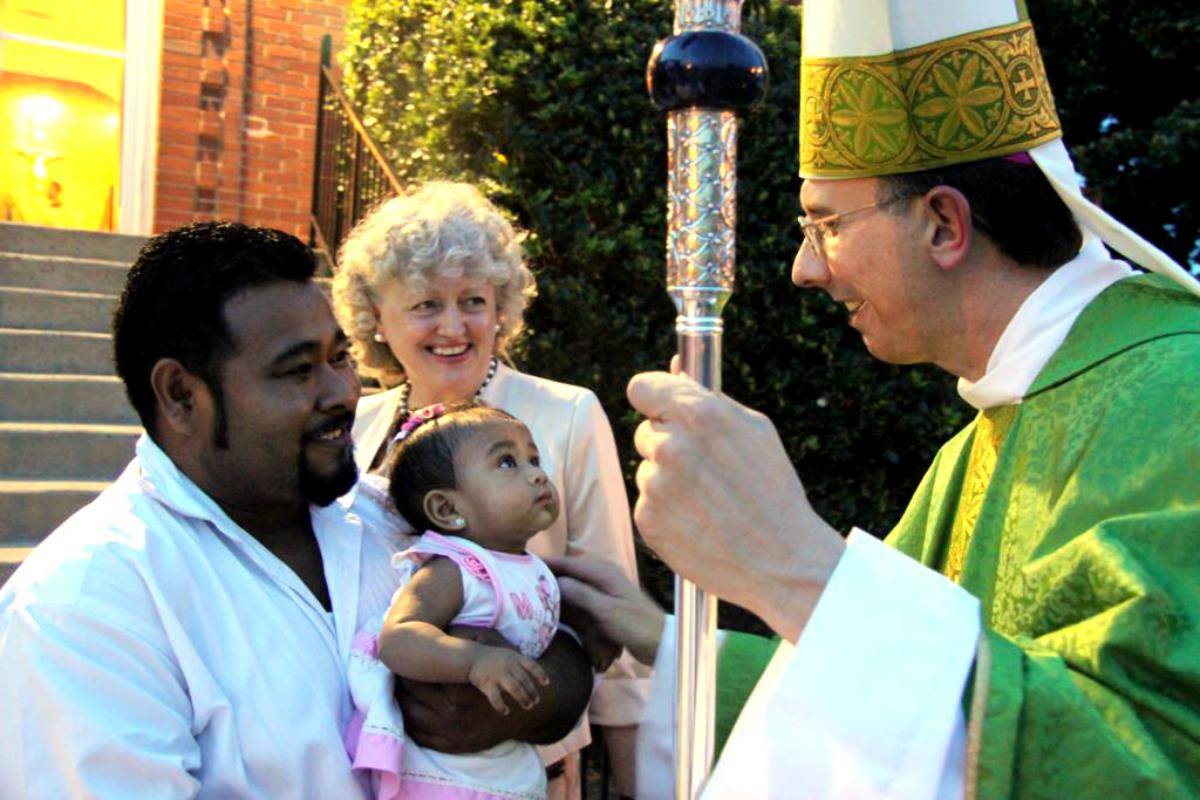 Greeting people after Mass in 2012.