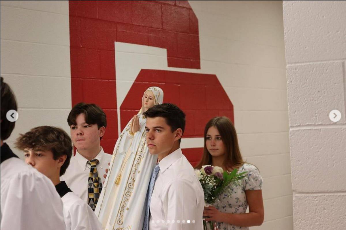 After Charlotte Catholic High School’s last all-school Mass of the school year, the seniors gathered to celebrate the annual tradition of May Crowning.