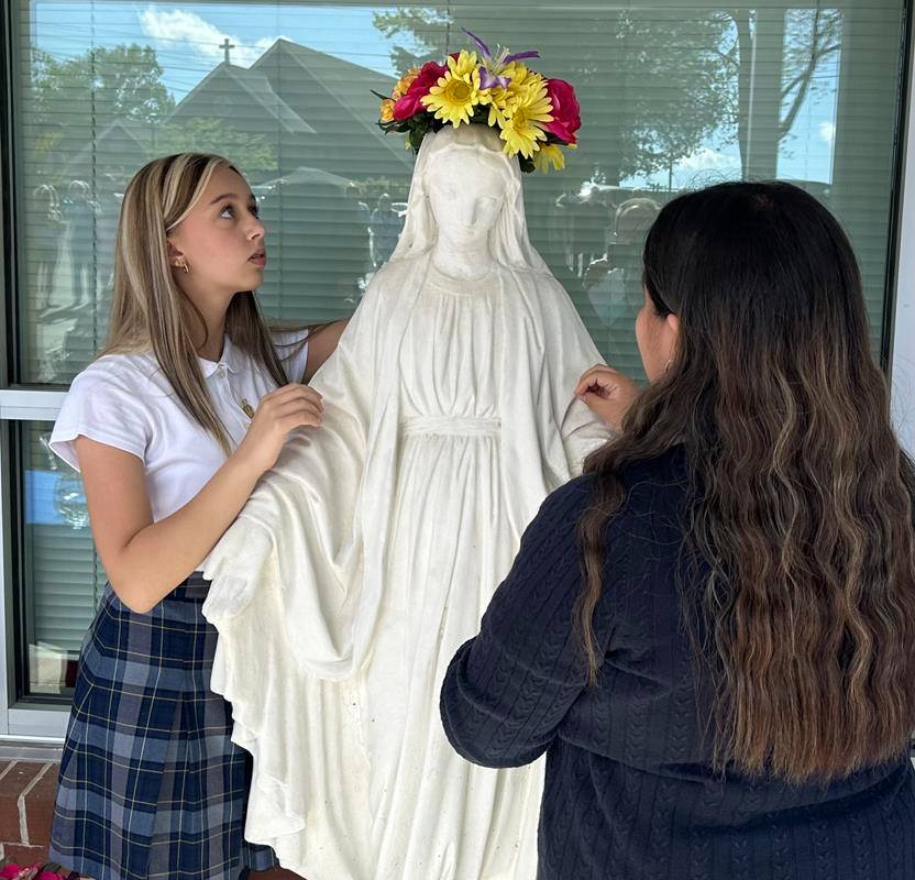 A May Crowning at Immaculata Catholic School in Hendersonville included a ceremony and students presenting flowers to Our Lady. 