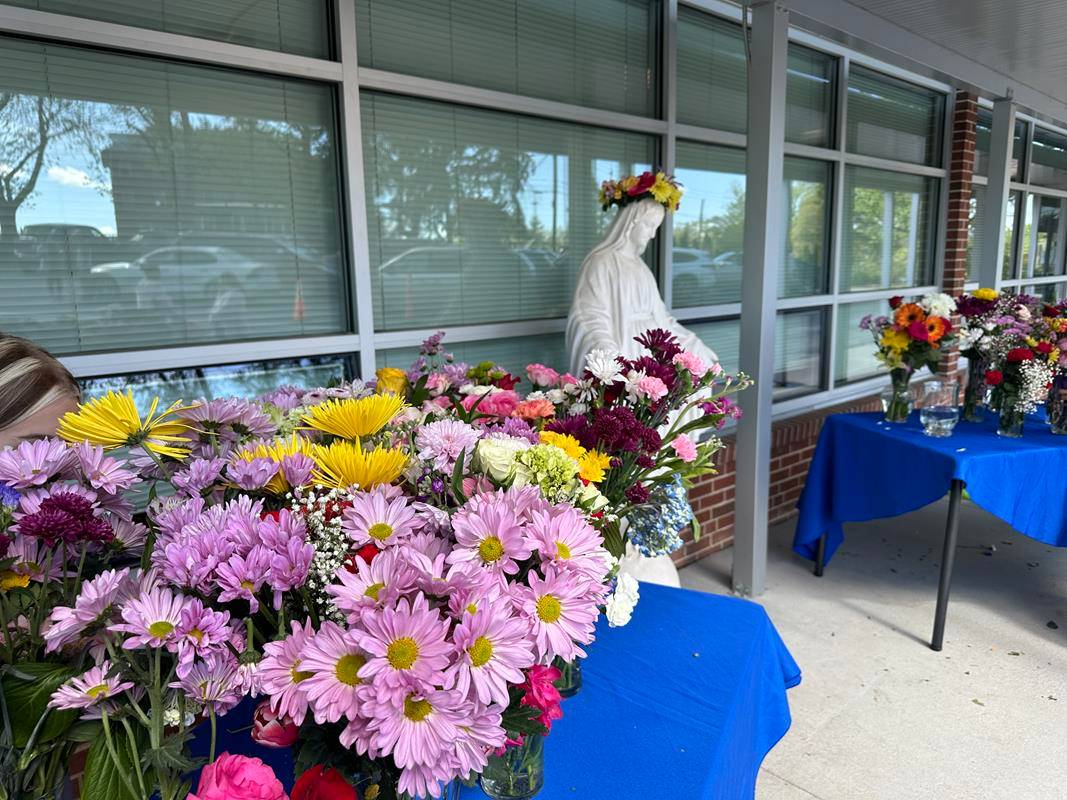 A May Crowning at Immaculata Catholic School in Hendersonville included a ceremony and students presenting flowers to Our Lady. 