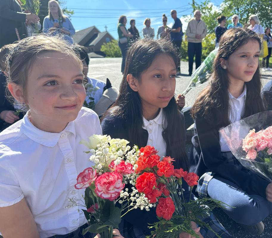 A May Crowning at Immaculata Catholic School in Hendersonville included a ceremony and students presenting flowers to Our Lady. 