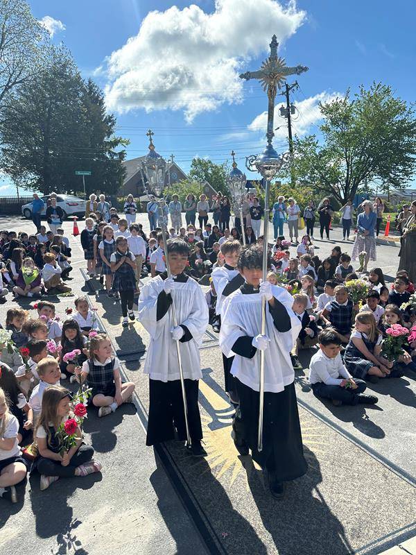 A May Crowning at Immaculata Catholic School in Hendersonville included a ceremony and students presenting flowers to Our Lady. 