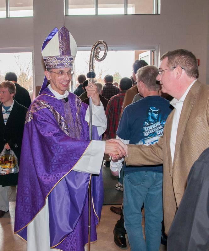 Bishop Jugis gretting after morning Mass in 2013